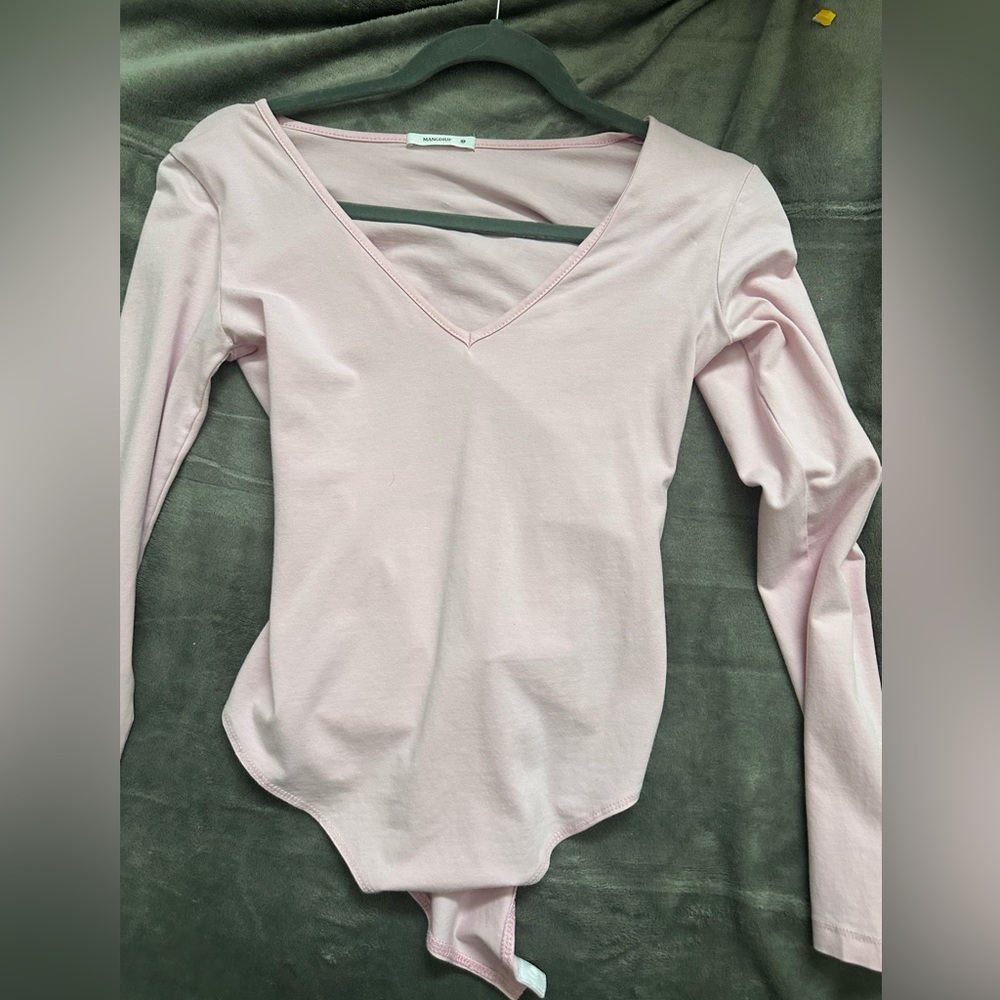 Worn a few times, light pink long sleeve bodysuit